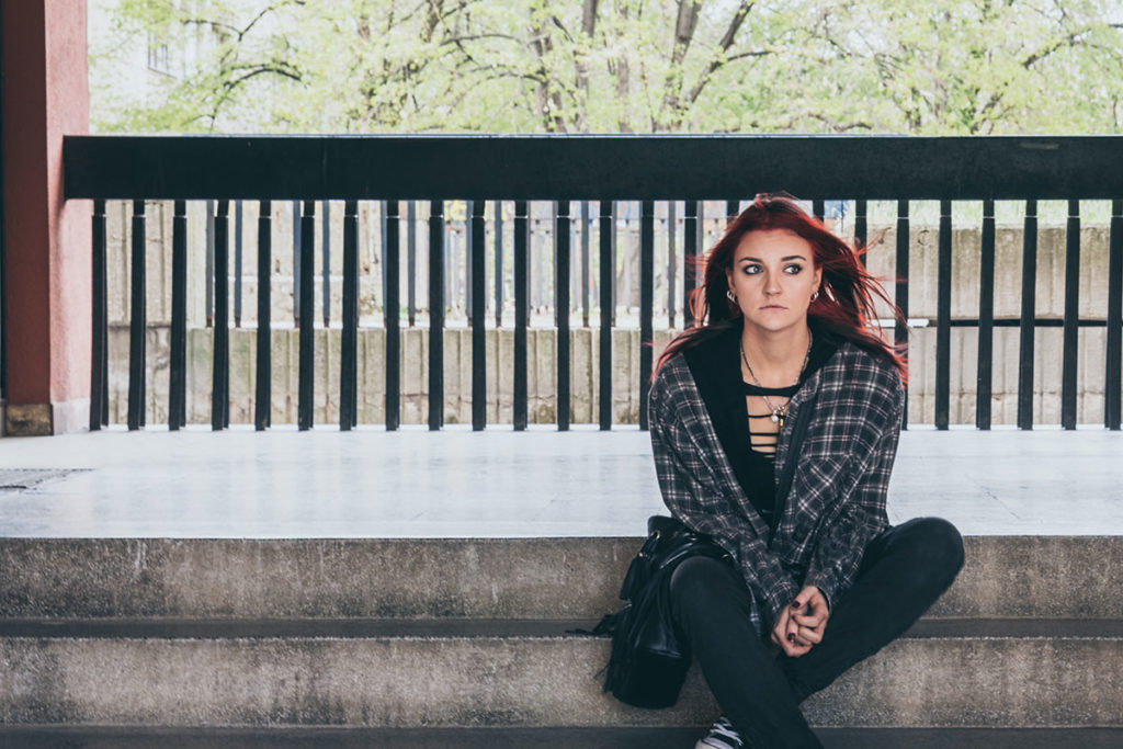 College student sitting alone