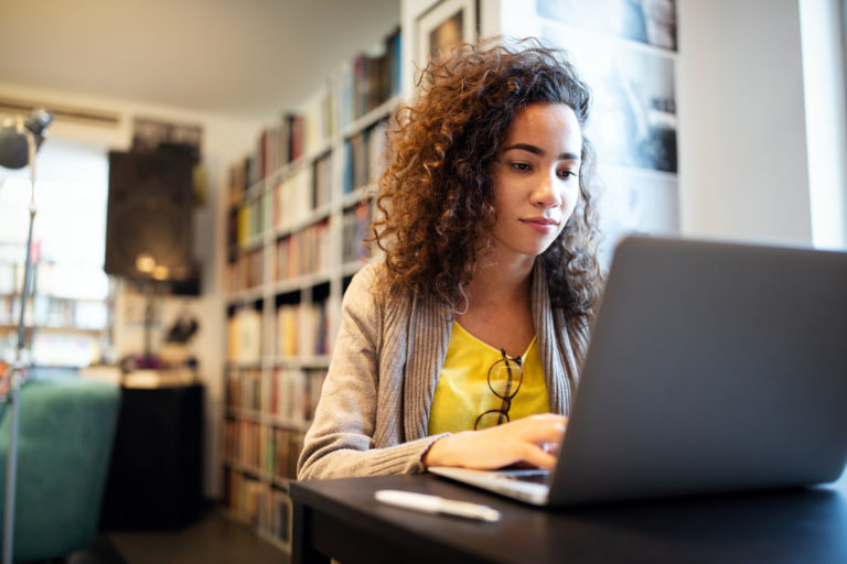 College student using virtual care on computer