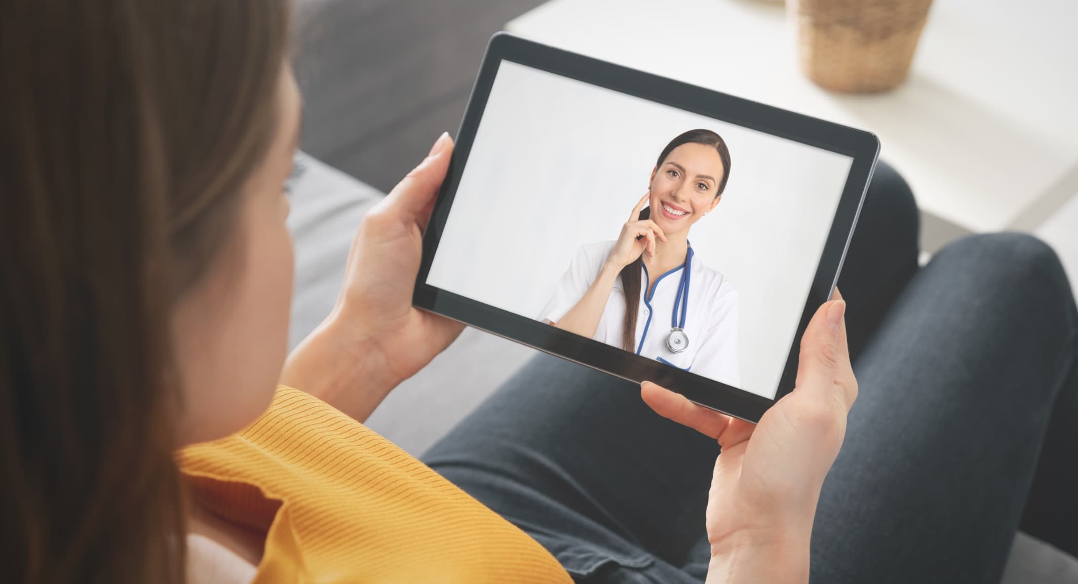 Woman with Doctor on Tablet