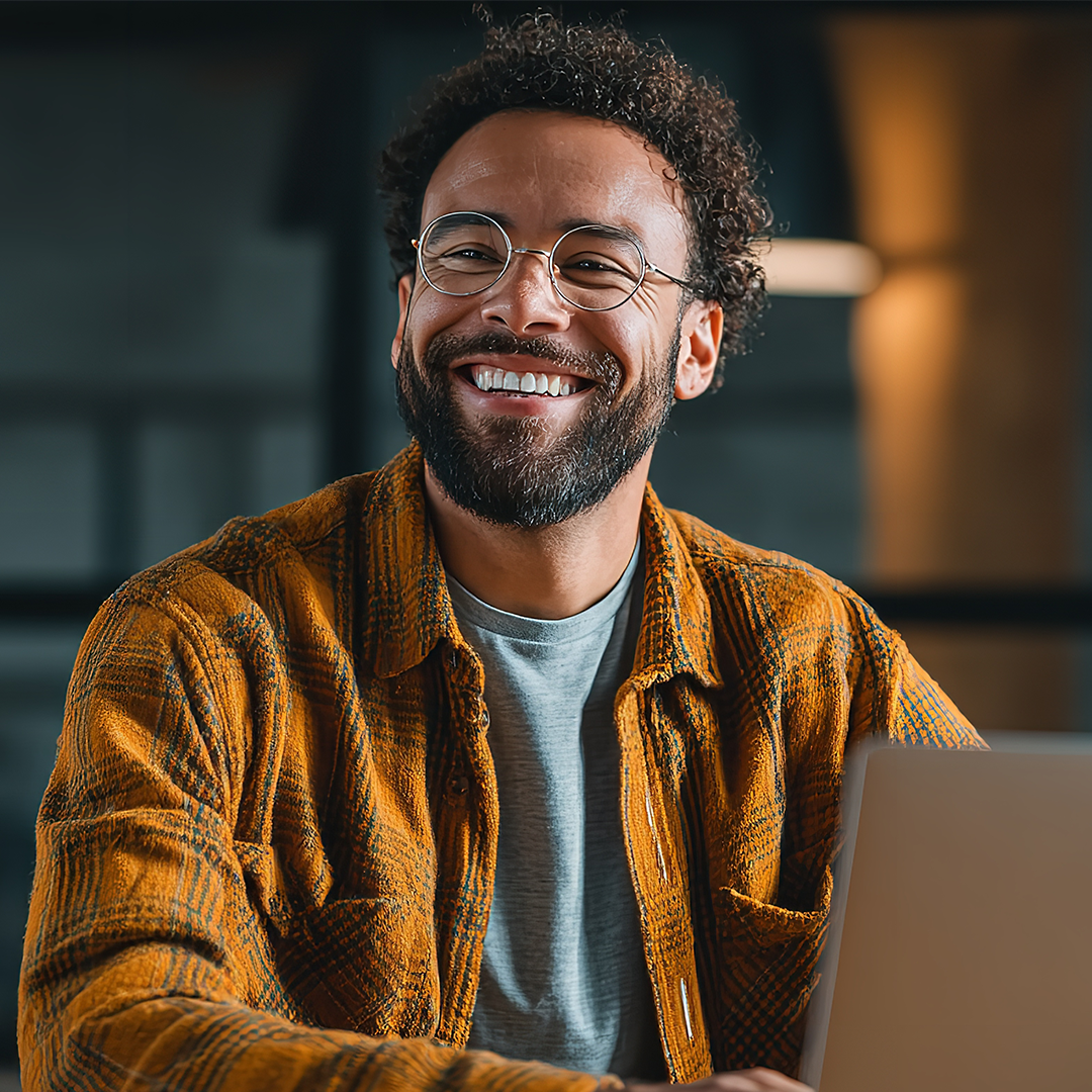College student studying and smiling