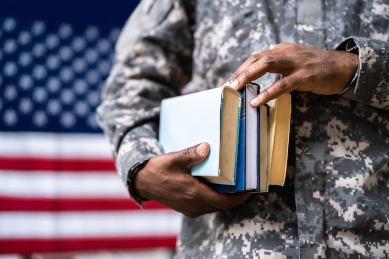 Veteran with textbooks