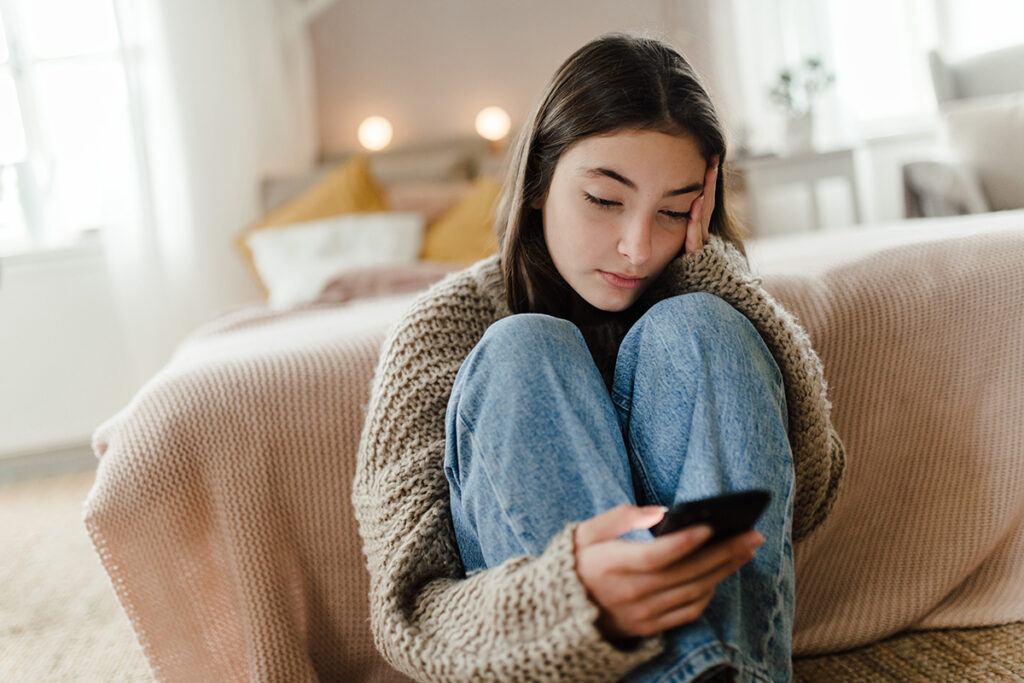 Teenage Girl Sitting On The Floor