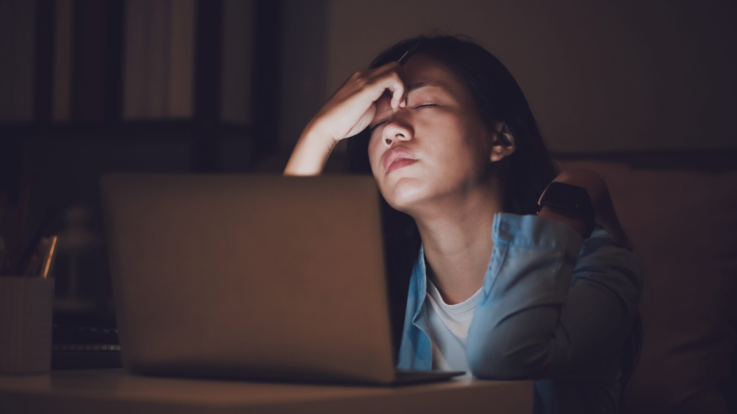 Student feeling stress while studying after hours