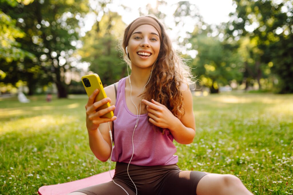 Young Sports Female With Smartphone