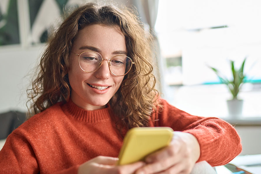 College student looking at phone
