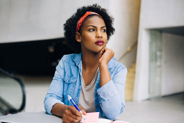 College student looking up while studying