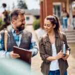 Professor and student walking across campus