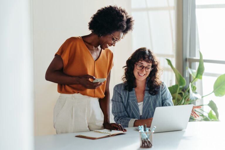 Happy,Professional,Women,Collaborating,With,Enthusiasm,In,A,Modern,Office