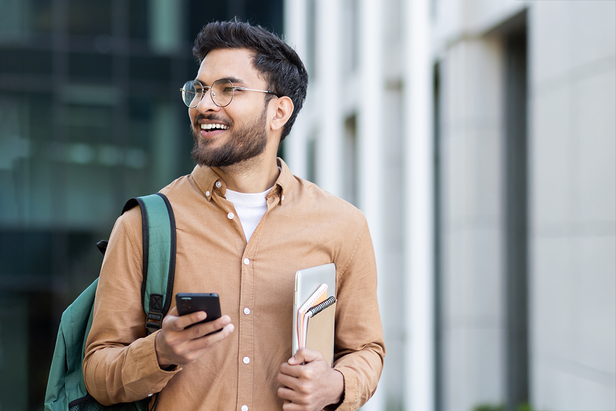 Male college student walking on campus