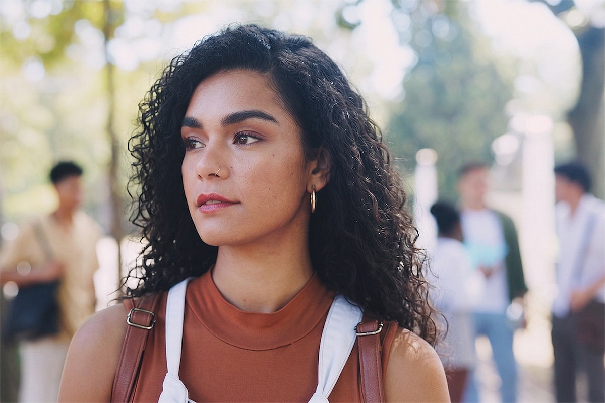 Female college student on campus looking away