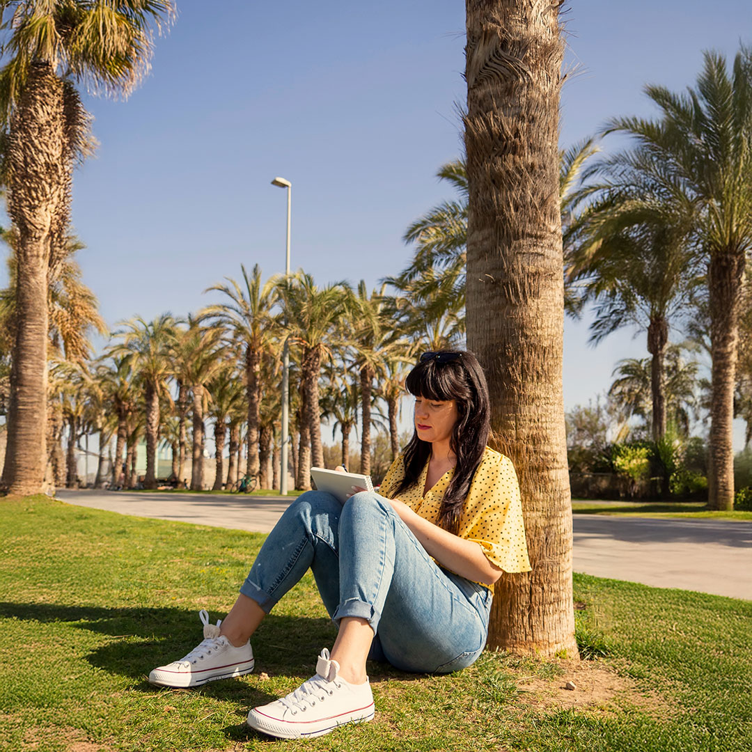 Student outside near beach