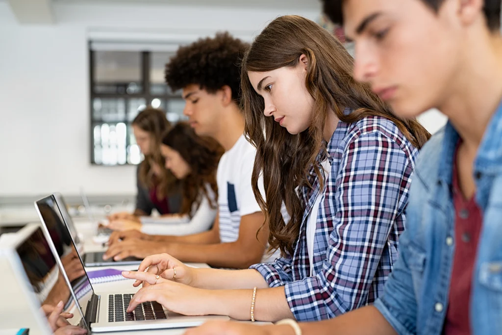 Students sitting with computers